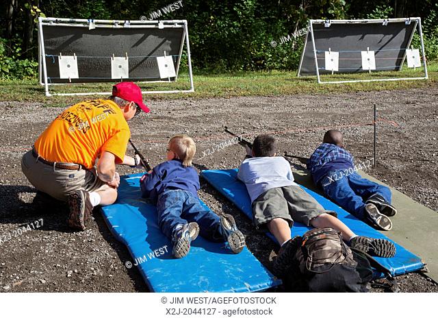 New Boston, Michigan - Boy Scouts and Cub Scouts shoot BB guns at a weekend gathering at a suburban Detroit park
