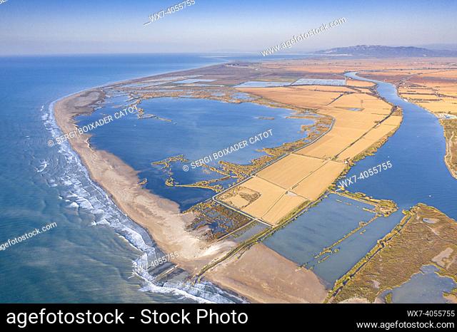 Aerial views of the river mouth and the Buda Island in the Ebro Delta at sunrise (Tarragona province, Catalonia, Spain)