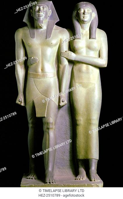 Statue of the Pharaoh Menkaure and his queen, Khamerernebty II. Menkaure (Mycerinus) was a Pharaoh of the 4th dynasty of Ancient Egypt
