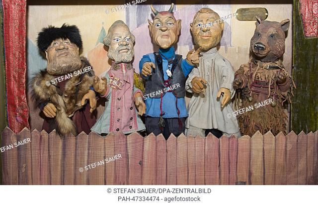 Theater puppets of the piece 'Iwan the fool' stand in the new puppet theater museum 'Homunkulus' on Hiddensee island in Vitte, Germany, 20 March 2014