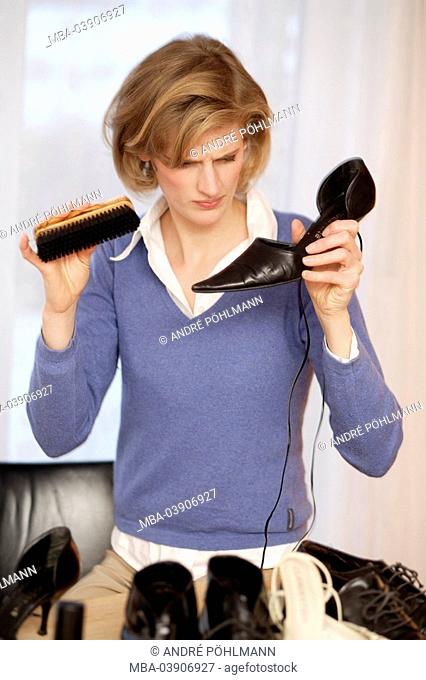 Woman, young, shoes, cleaning, brushing, semi-portrait