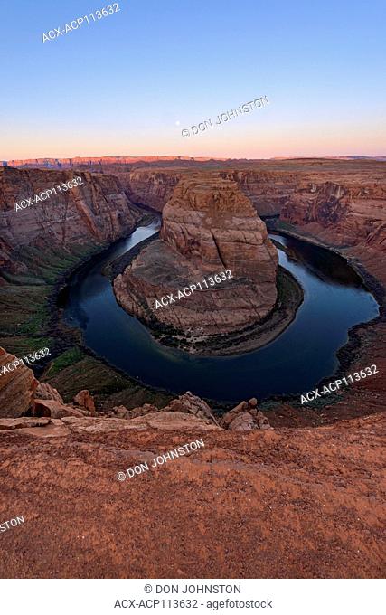 Horseshoe Bend of the Colorado River with setting moon, Page, Arizona, USA