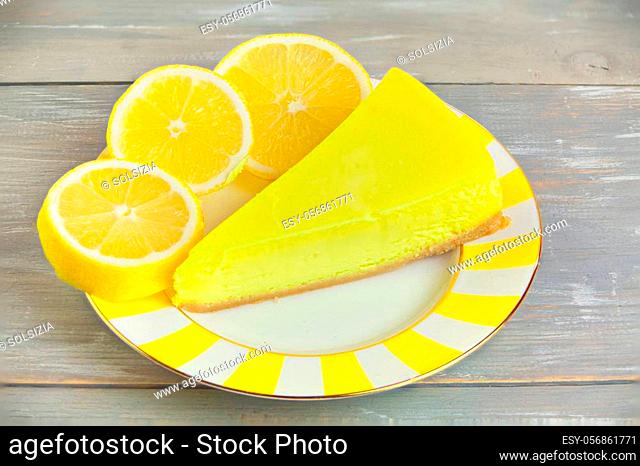 delicious cheesecake with lemon on a plate