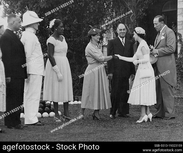 Princess Margaret, escorted by Gov. Sir Hubert Rance, right, is greeted by Trinidad residents during garden party in Port of Spain, Feb. 2