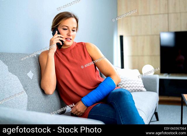 Injured Woman Talking On Phone At Home After Accident