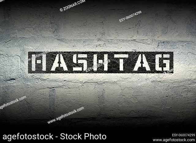 hashtag stencil print on the grunge white brick wall