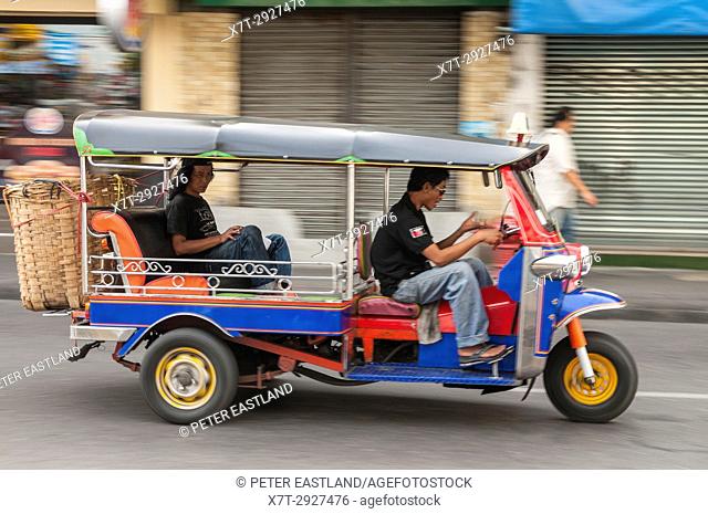 Tuktuk taxi on the road in the Banglamphu district of Bangkok, Thailand