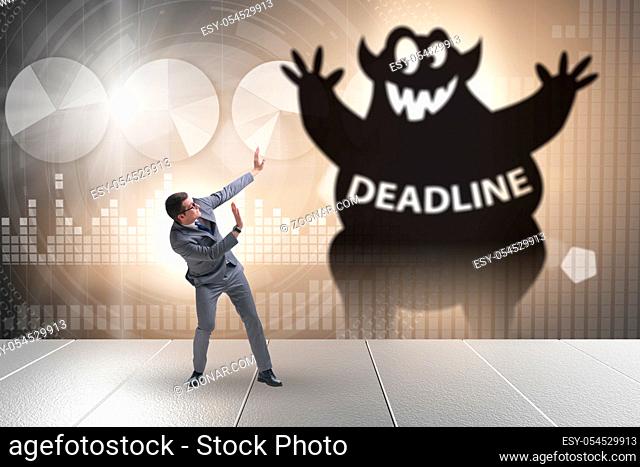 Businessman missing important deadline with the monster