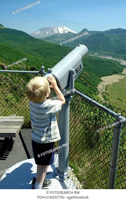 Mount St. Helens National Volcanic Monument, WA, Washington, Forest Learning Center at Mt. Saint Helens, overlook, young boy looking through a telescope