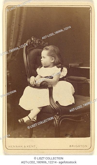 Little girl seated sideways in an armchair; Hennah & Kent; about 1870; Albumen silver print