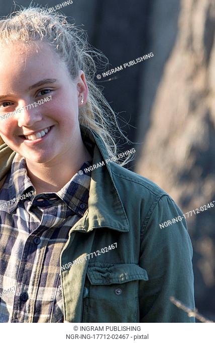 Portrait of a girl smiling, Skerwink Trail, Port Rexton, Bonavista Peninsula, Newfoundland And Labrador, Canada
