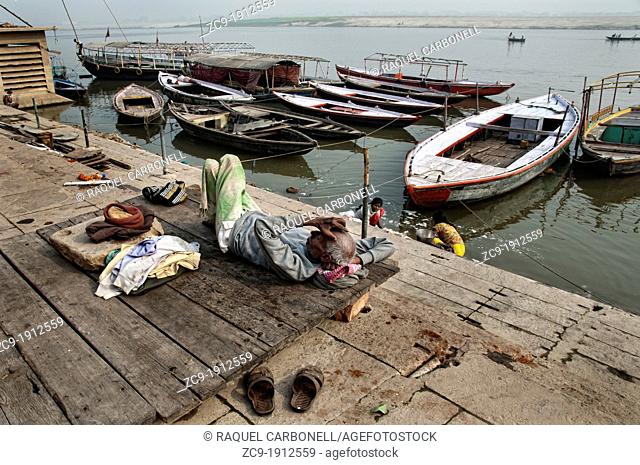 Elder man resting at the Ganges riverbanks  Varanasi, Benares, Uttar Pradesh, India