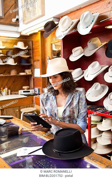 Ecuadorian woman working in hat store