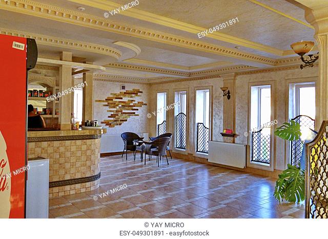Decorated with a tiled room restaurant with wicker furniture and a bar counter