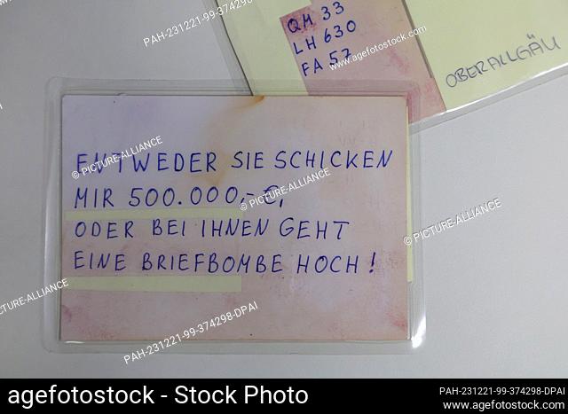 21 December 2023, Bavaria, Kempten: A postcard from a blackmailer with the inscription ""Either you send me ·500, 000 or a letter bomb will go off in your house