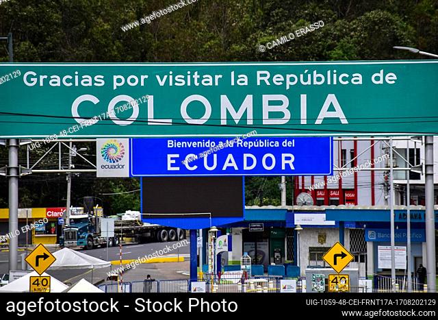 Signs of ""Thank you for visiting Colombia and Welcom to Ecuador"" seen close at the Colombia-Ecuador border as drivers of public service vehicles hold protest...