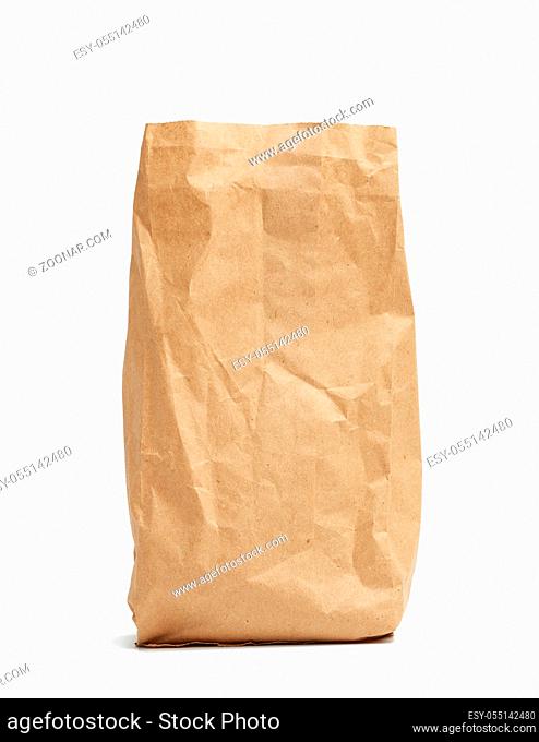paper disposable bag of brown kraft paper isolated on white background, concept of rejection of plastic packaging, template for designer