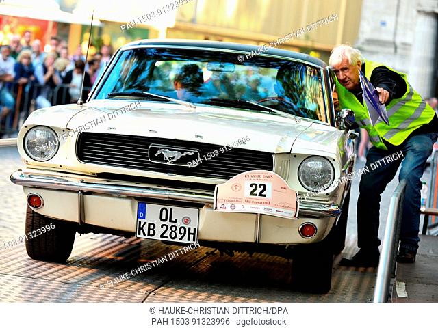 Participants start with a vintage car of type Ford Mustang at the City Grand Prix in Oldenburg (Germany), 26 May 2017. | usage worldwide