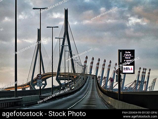 31 December 2019, Hamburg: The Köhlbrand bridge with a digital display. More than 3, 600 metres long, the bridge is the second longest road bridge in Germany...