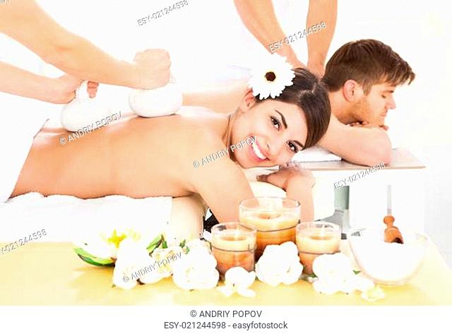 Woman Receiving Massage With Herbal Compress Stamps