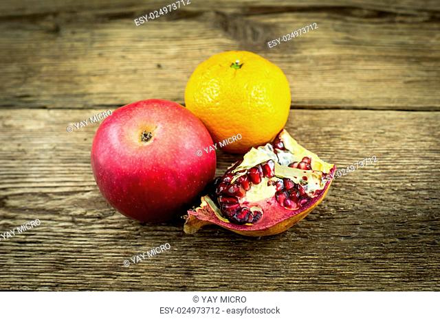 exotic fruits lie on a wooden background