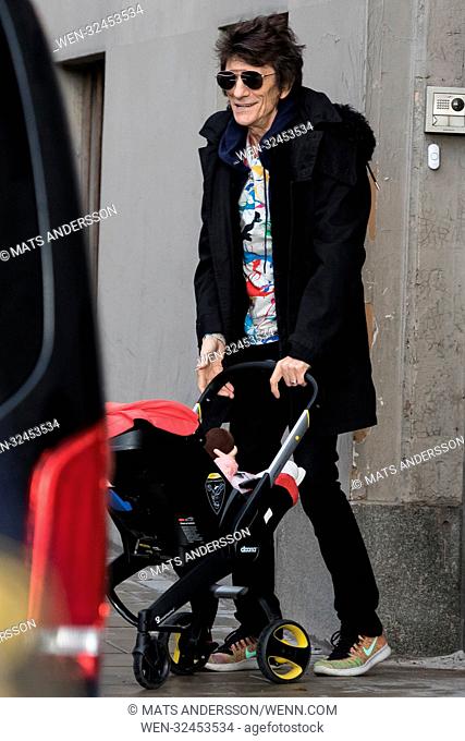 Ronnie Wood and his wife Sally Humphreys leaving Grand hotel in Stockholm with their twin daughters in a pram Featuring: Ronnie Wood Where: Stockholm