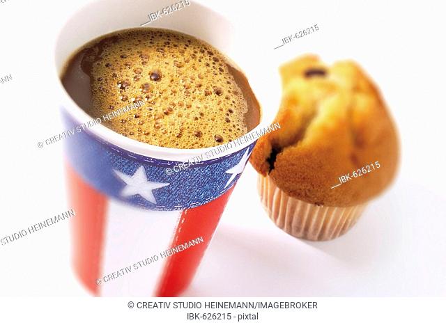 Paper cup with U.S. stars-and-stripes design and muffin