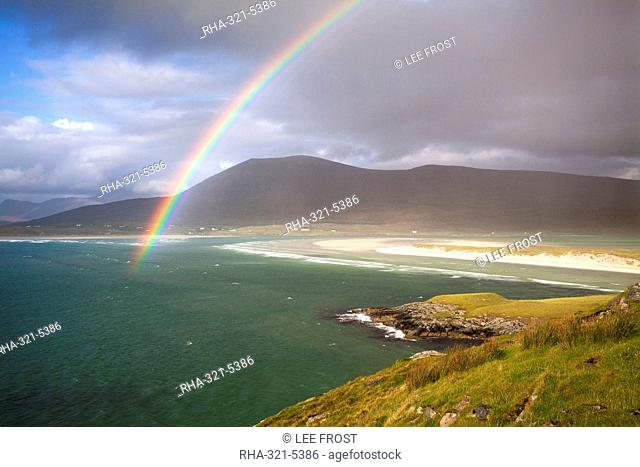 View across the beach at Seilebost towards Luskentyre and the hills of North Harris with a rainbow arching across the scene, Seilebost, Isle of Harris