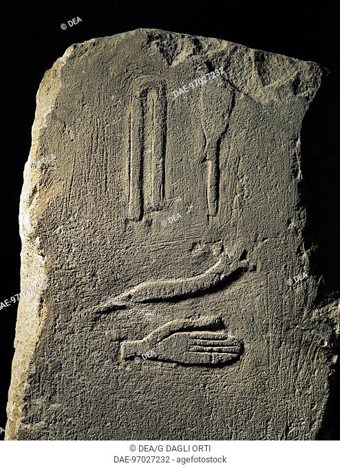 Egyptian civilization, Early Dynastic Period. The birth of writing. Thinite stele depicting four hyeroglyphs: hand, snake, folded cloth and tool