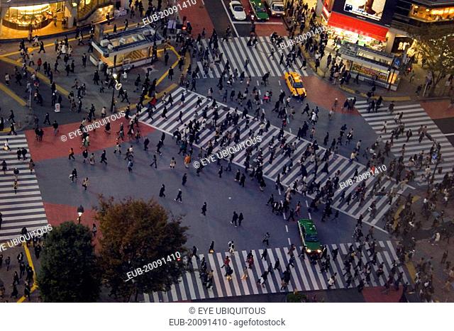 Shibuya District. Meiji-dori with Dogen-Zaka junction outside Shinjuku Station. View from above over one of the busiest junctions in the world with crowds on...
