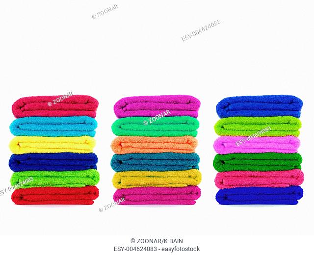Colored towels isolated against a white background