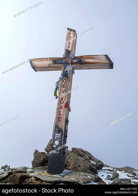 summit cross of the cevedale 3769 m, the third highest mountain in the ortler alps