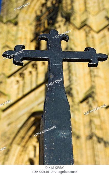 England, East Riding of Yorkshire, Bridlington. Wrought iron gate detail in the shape of a cross outside the Priory Church of St Mary