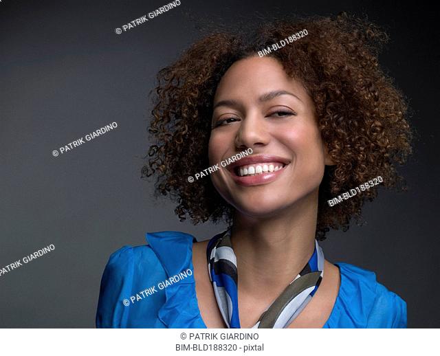 Mixed Race woman wearing scarf around neck