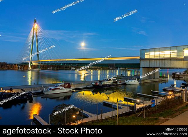 Vienna, full moon above river Donau (Danube), subway U2 bridge Donaustadtbrücke, Marina Wien with boats in 02. Leopoldstadt, Austria