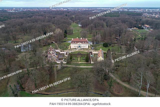 14 March 2019, Brandenburg, Branitz: The castle (M) and outbuilding in the Fürst-Pückler-Park (aerial view with a drone)