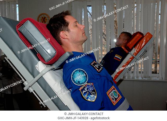 At their Cosmonaut Hotel crew quarters in Baikonur, Kazakhstan, Expedition 50-51 crewmembers Thomas Pesquet of the European Space Agency (foreground) and Oleg...