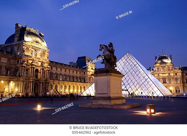 The night view of Cour Napoleon of Musee du Louvre with Pyramid Entrance in the background. Paris. France