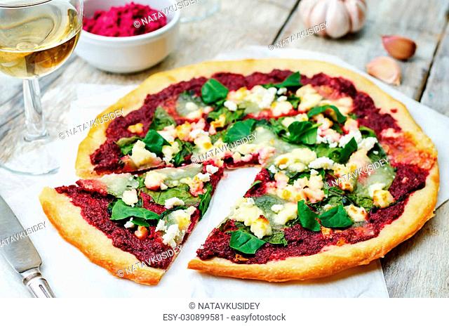 beet hummus spinach goat cheese pizza. the toning. selective focus