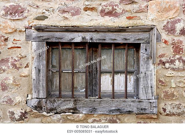 Aged wooden window in masonry stone house