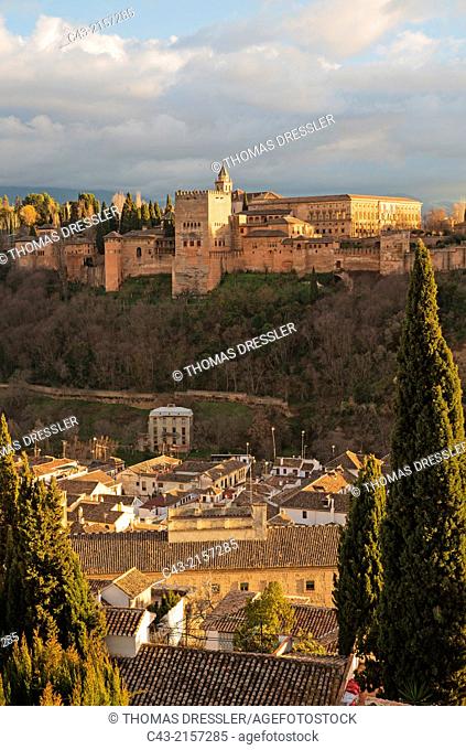 The magnificent Alhambra palace in the evening. In the foreground the Albaicín, Granada's characteristic Moorish quarter