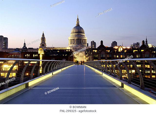 Bridge across river leading towards church, Millennium Bridge, Thames River, St. Pauls Cathedral, London, England