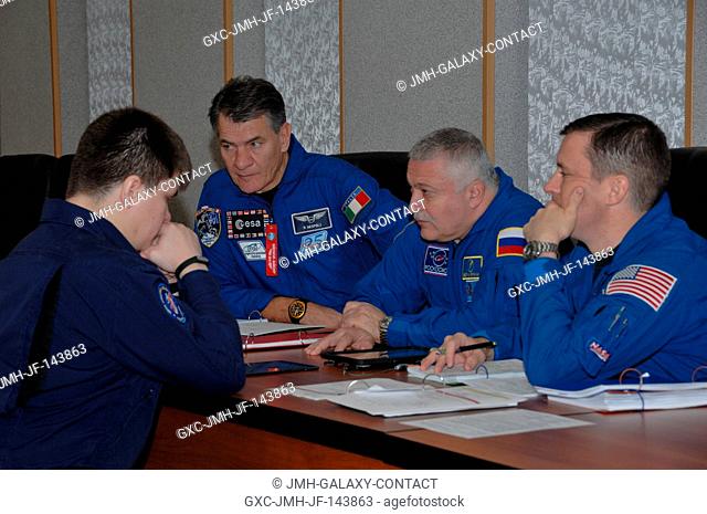 At their Cosmonaut Hotel crew quarters in Baikonur, Kazakhstan, Expedition 50-51 backup crewmembers Paolo Nespoli of the European Space Agency (left)