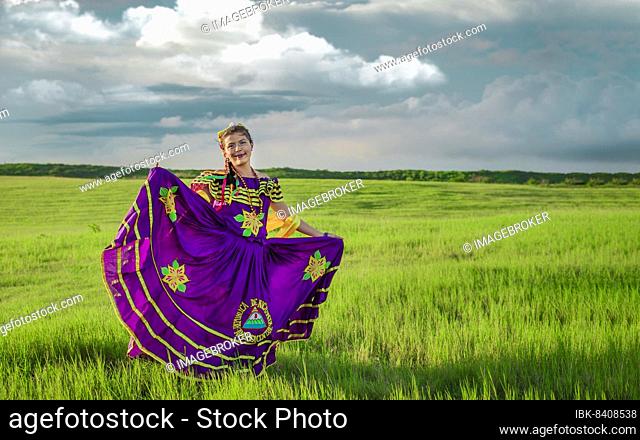 Young Nicaraguan woman in traditional folk costume in the field, Portrait of Nicaraguan girl in traditional folk costume in the field