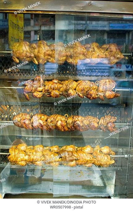 Grilled chicken in glass case , Mirpur road , Dhanmondi , Dhaka , Bangladesh