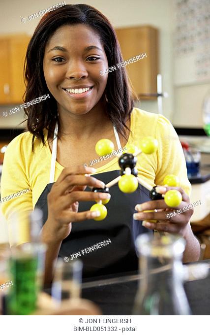 African American teenaged girl in science class