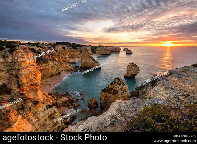 Rocky coast at Praia da Marinha at sunrise, Lagoa, Algarve, Faro district, Portugal