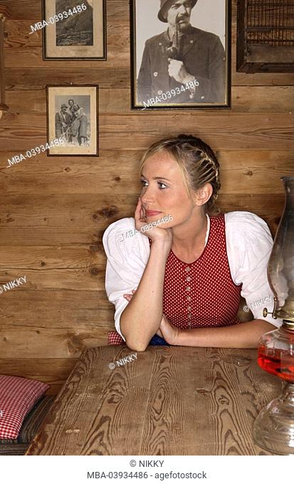 Woman, table, birdcage, oil lamp