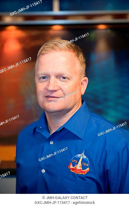 NASA astronaut Eric Boe, STS-133 pilot, poses for a portrait following a preflight press conference at NASA's Johnson Space Center