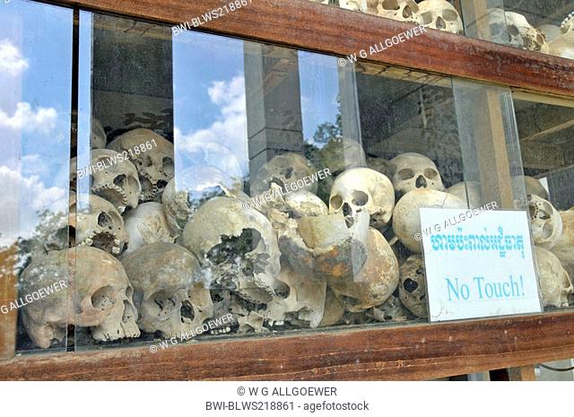Human skulls on display in the glass-sided stupa, Cambodia, Phnom Penh